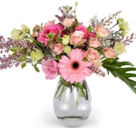 This darling bouquet features a variety of blooms in different shades of pink, artfully arranged in a contemporary design.