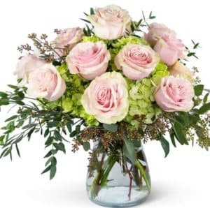 Soft Pink Roses that sit atop Green Hydrangea and Premium Greenery. 