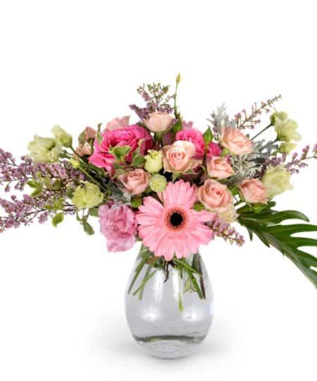 Peek-A-Boo, I see you! Do you see pink everywhere you look? This darling bouquet features a variety of blooms in different shades of pink, artfully arranged in a contemporary design.